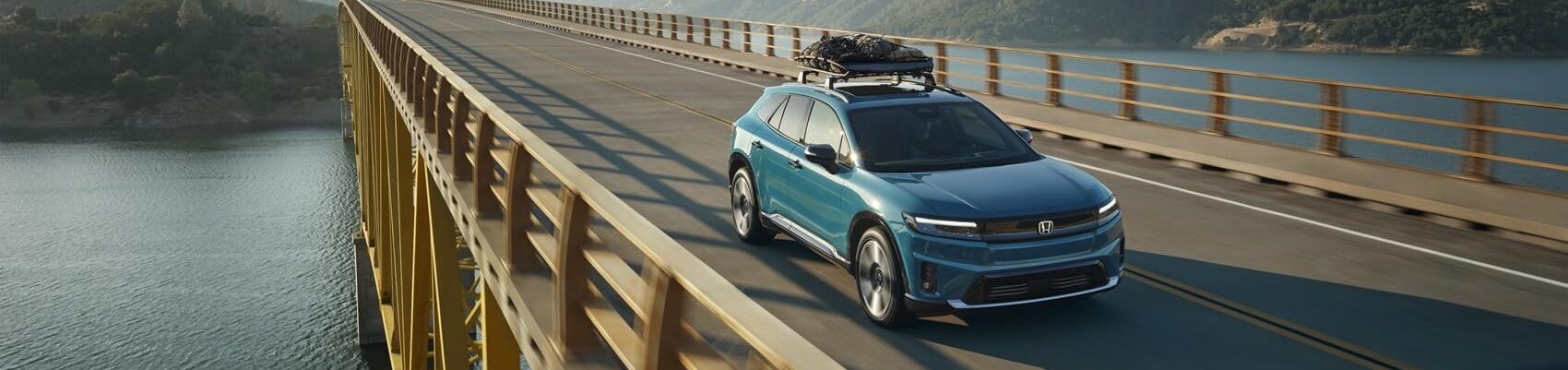 Honda SUV driving on bridge