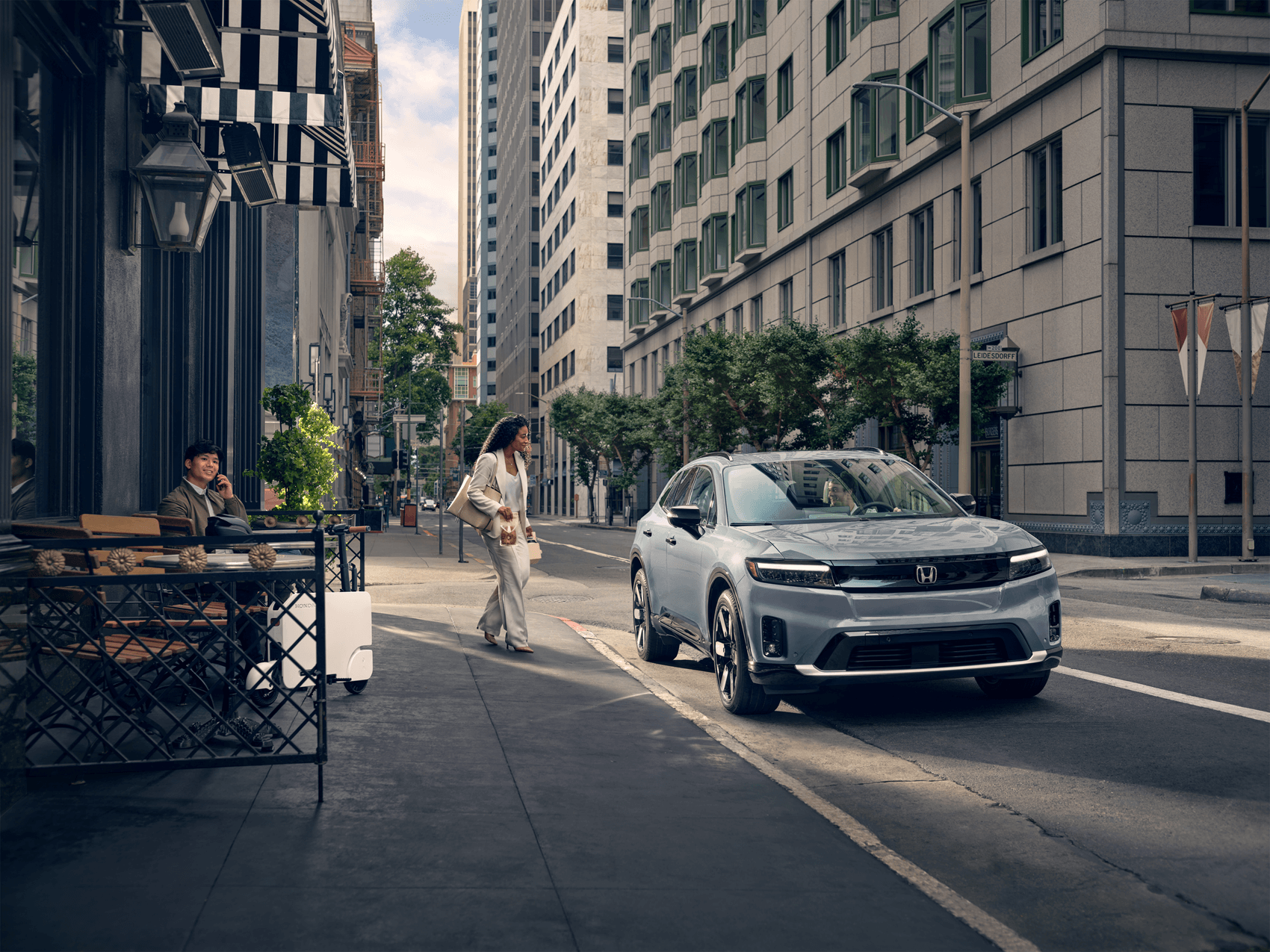 Honda SUV parked on street of busy city